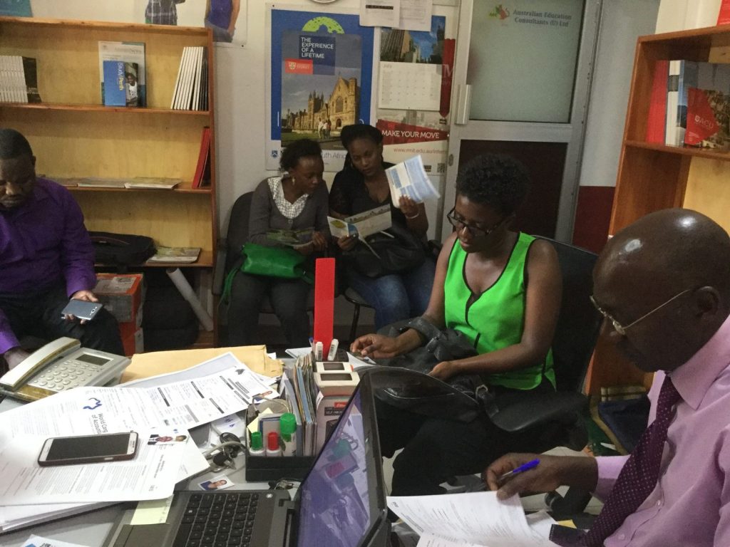 Students receiving guidance at the AEC Uganda office
