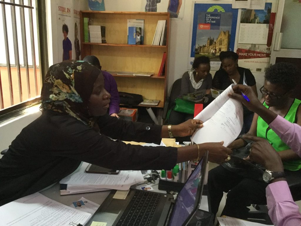 AEC Uganda counsellor reviewing an application with a student